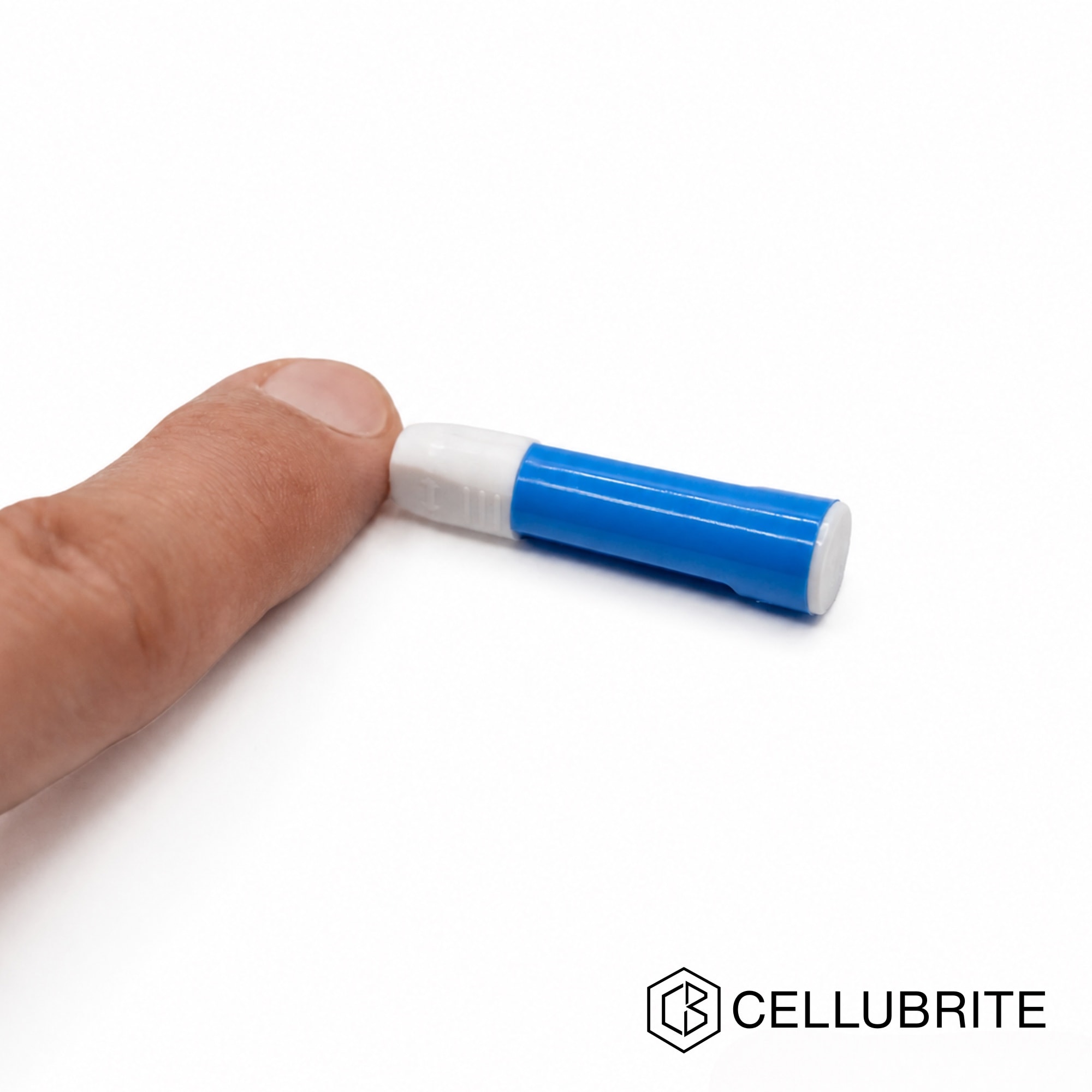 Blue and white lancet positioned against a fingertip
